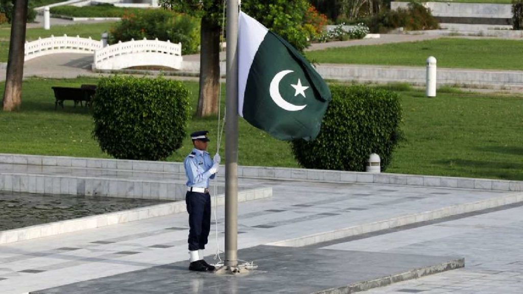 A member of the Pakistan Air Force rehearses flag masting at the mausoleum of Muhammad Ali Jinnah before the Defence Day ceremonies, or Pakistan's Memorial Day, in Karachi, Pakistan September 6, 2020.