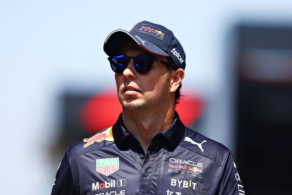 Sergio Perez walks in the Paddock during previews ahead of the 2022 French GP. (Photo by Clive Rose/Getty Images)
